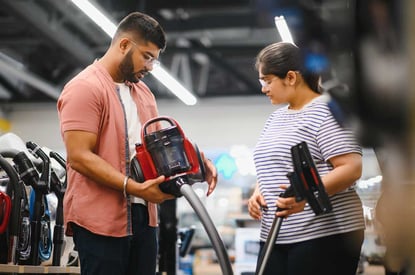 a-young-indian-couple-buys-a-vacuum-cleaner-at-web