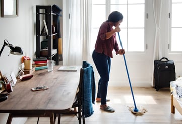 black-woman-cleaning-room-2022-12-16-00-19-57-utc-1