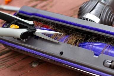 close-up-of-the-under-side-of-a-vacuum-cleaner-wit-web