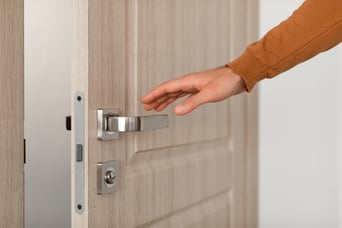 closeup-of-guy-opening-wooden-door-reaching-hand-2022-12-16-08-14-21-utc