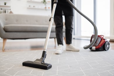 cropped-view-of-hands-holding-vacuum-cleaner-web