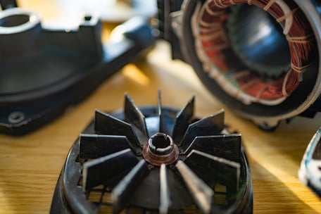 disassembled-electric-motor-parts-on-a-wooden-surf-web