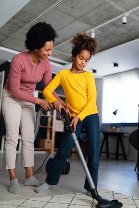 girl-and-woman-vacuuming-in-a-home-interior-web