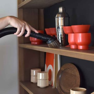 Kirby's hose attachment makes it easy to dust and declutter your home.