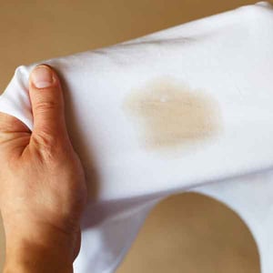 Coffee stain on white shirt.