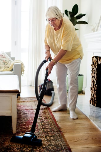 senior-woman-vacuuming-the-floor-in-her-home-web