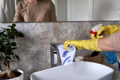 unrecognizable-woman-cleaning-bathroom-tap-2023-11-27-05-14-35-utc