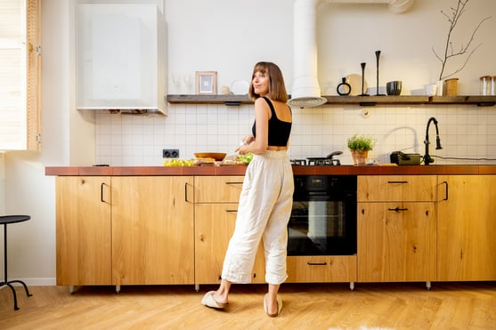 woman-with-healthy-food-in-kitchen-at-home-2022-09-02-18-45-46-utc